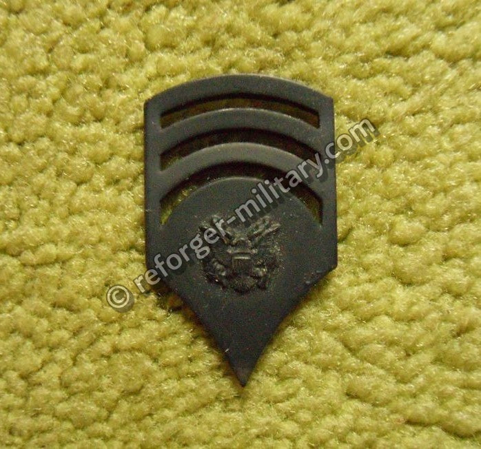 U.S. Army Specialist 7 (SP7) Rangabzeichen aus Metall – Subdued Rank Insignia Vietnam Era Expert Grade.
