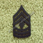 U.S. Army First Sergeant (1SG) Rangabzeichen aus Metall – Subdued Rank Insignia with Diamond for BDU Uniform.